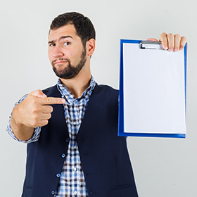 Man Pointing at a Paper