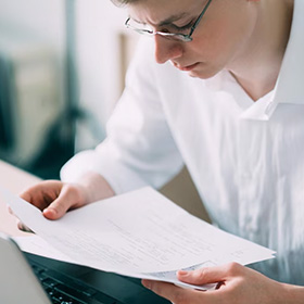 A Person Looking at a Document