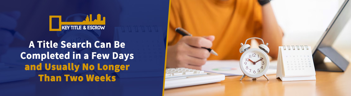 A Person Holding a Pen on a Desk