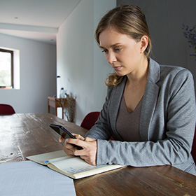 A Woman Looking at Her Phone