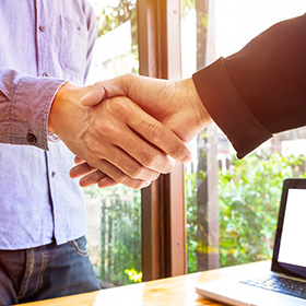 Two People Shaking Hands