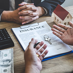 People Discussing an Insurance Policy