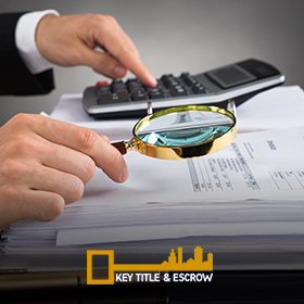 Picture of a Escrow Agent Checking a Property Document in Miami